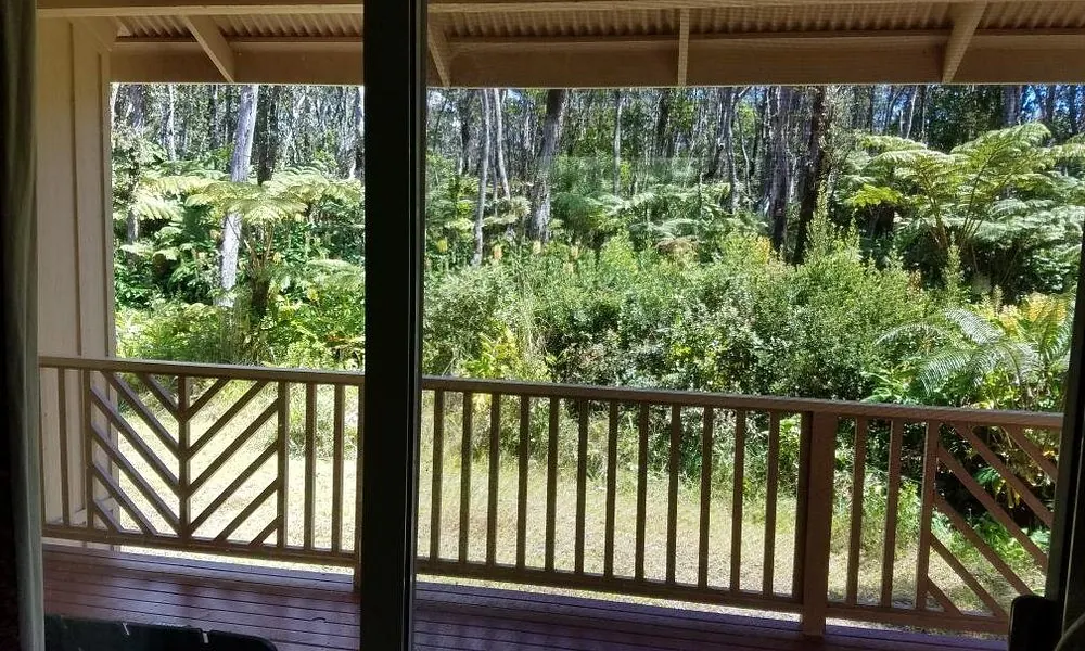 Private deck looking into the rainforest at Volcano Forest Inn